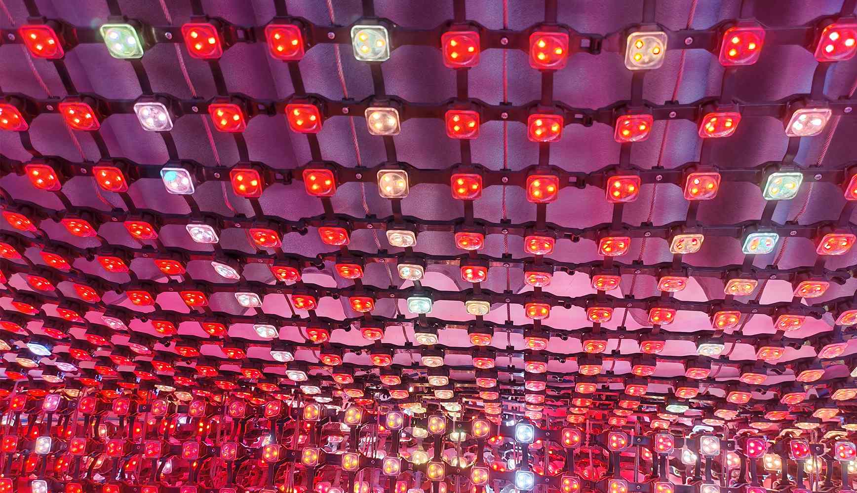 How Wind Load Affects LED Mesh Screen Design for High-Rise Building Facades